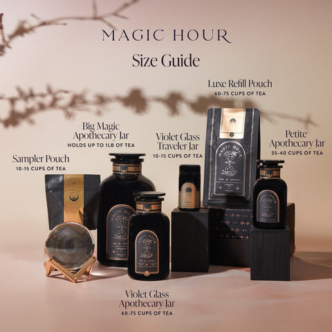 An image showcasing various Magic Hour tea containers, including Goddess of Earl: Lavender London Fog - Tea for Blooming Clarity & Calm Moods options, arranged on wooden blocks. It features a Luxe Refill Pouch, Big Magic Apothecary Jar, Violet Glass Traveler Jar, Violet Glass Apothecary Jar, Petite Apothecary Jar, and a Sampler Pouch. Text outlines their capacities and aromatherapeutic benefits for relaxation and calm focus.