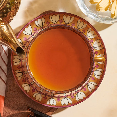 Top Down close up of Campfire Breakfast Loose Leaf Tea Steeped in an ornate tea cup