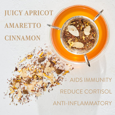 Overhead view of a loose leaf tea with dried ingredients, including apricot slices, amaretto bits, and cinnamon pieces. Text reads: "Carnelian : Caffeine-Free Apricot Amaretto Tea" and "Aids Immunity," "Reduce Cortisol," and "Anti-inflammatory." Experience the benefits of Magic Hour.