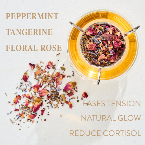 A glass teapot filled with Child's Pose™ Herbal Adaptogen Tea for Sleep & Restful Calm by Magic Hour sits on a white surface next to a scattered blend of dried loose leaf tea ingredients, including rose petals and other colorful flowers. Text around the image highlights the flavors: Peppermint, Tangerine, Floral Rose, and benefits: Eases Tension, Natural Glow, Reduce Cortisol.