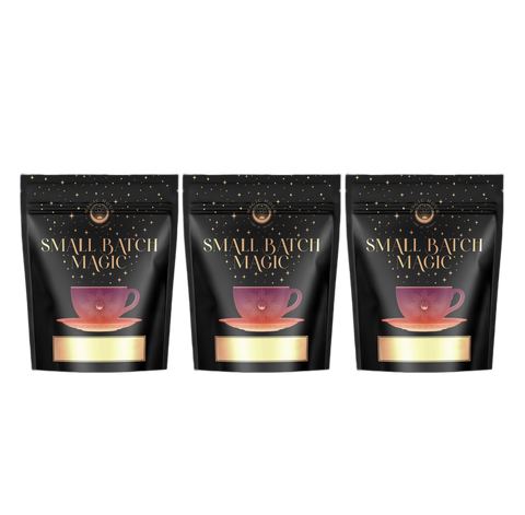 Three black pouches with gold and red accents, arranged side by side against a white background. The packaging features a gold teacup with the text "Small Batch Magic" prominently displayed above it, showcasing the wonderfully nostalgic flavors of the guilt-free Ceremonial Soda Pop Tea Bundle from Magic Hour, featuring Cherry Cola, Lemon Lime, and Cream Soda teas.