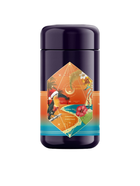 A cylindrical, dark purple tin container with vibrant tropical artwork on the label. The label features a colorful toucan, tropical flowers, and geometric shapes with the text "Hibiscus Holiday Case Packs" by Magic Hour. Infused with mood-enhancing herbs, the festive background blends from orange to teal.